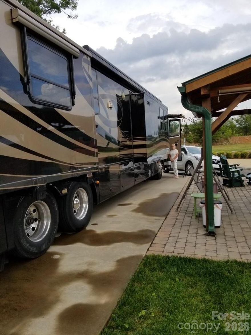 Welcome to Sunset Ridge MotorCoach Resort, a private, Class-A-only motorhome community located in beautiful Franklin, North Carolina. Nestled in the heart of the Appalachian Mountains, this peaceful retreat offers easy access to local restaurants, shopping, waterfalls, tubing, sightseeing, and countless outdoor attractions. Conveniently located near Atlanta, Asheville, Knoxville, and Gatlinburg, Sunset Ridge blends mountain serenity with excellent accessibility. This quaint 52-lot community offers a true sense of belonging, complete with weekly gatherings and a friendly, welcoming atmosphere that makes you feel right at home. Now available is a spacious back-in lot accommodating up to a 45-foot coach, featuring a small private home with a living room and bathroom, plus a separate building with a brand-new, full-size kitchen. Offered at $300,000, the sale includes a 2004 Newmar Essex motor coach. The owner will also consider offers on the property without the coach. Own your piece of mountain paradise—call today