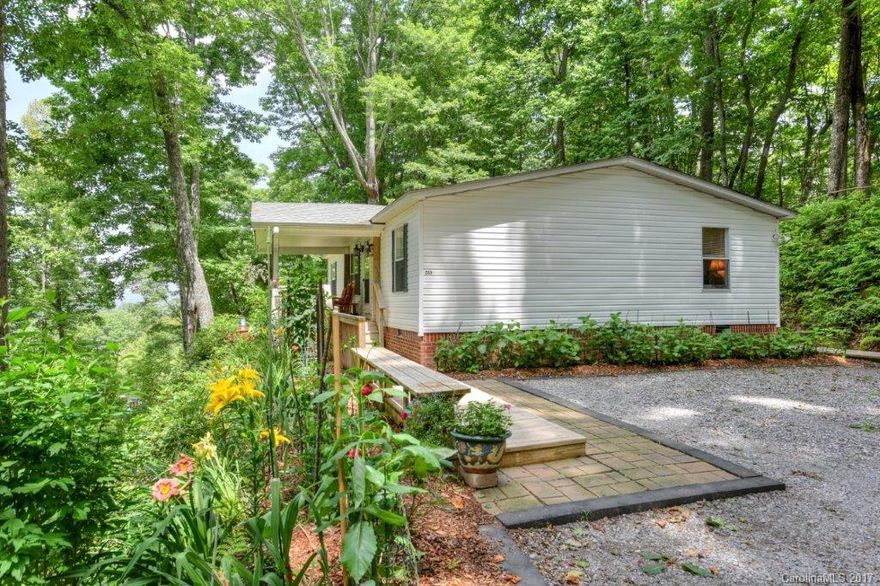 Totally updated and upgraded double wide in a quiet convenient location in Jonathan Valley.  This perfectly landscaped easy to care for property is a picture for "Better Homes & Gardens Magazine".  The inside of this 3 bedroom 2 bath home is immaculately kept and the open floor plan is made for entertaining or for a great family space.  Don't miss this one priced to sell under the current Certified Appraisal.