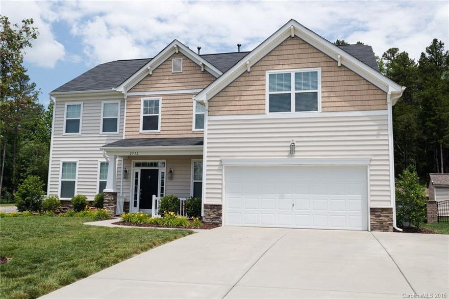 MOVE IN READY & PRICED TO SELL! Gorgeous 4BR/2.5BA open concept floor plan on corner lot.  Hardwoods throughout main level. Granite kitchen w/oversized island, 42” cabinets, stainless appliances, & gas range. Built in drop zone & integrated house vacuum system. Master suite with tray ceiling features a master bath w/ceramic tile floors, separate garden tub & walk-in frameless shower. Large bonus room. Fenced in level backyard with Belgard paver patio backs up to trees for extra privacy!