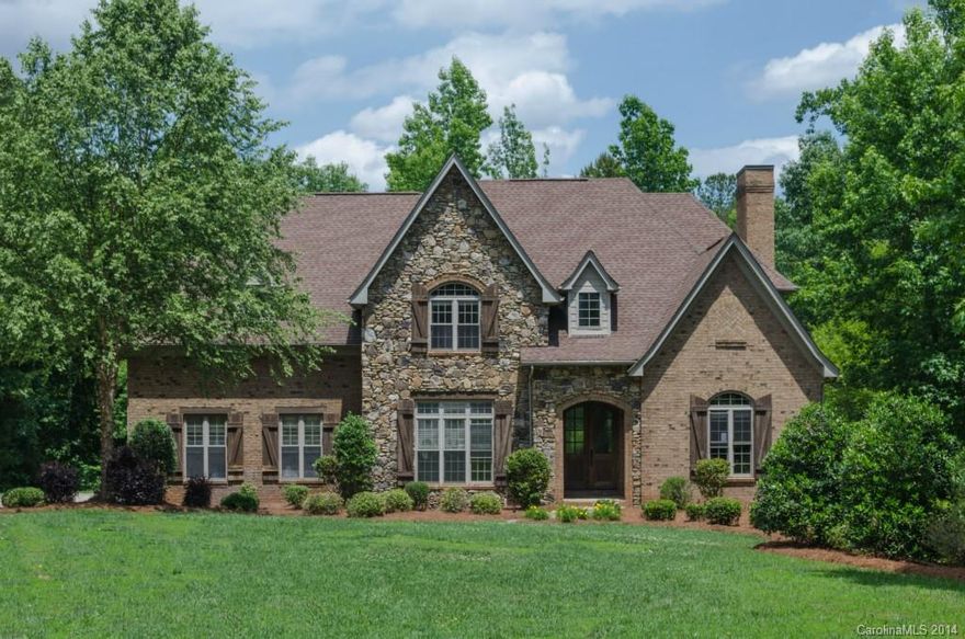 Spectacular cul-de-sac home is the epitome of perfection & seamlessly blends old European Cottage style w/modern amenities. French-style glazed kitchen cabinets, granite countertops, upgraded appliances. Large study with paneled walls & vaulted ceiling w/stained beams. Wooded views from 416 SF of covered verandas on two levels. Unfinished basement. Sophistication & old world architecture define every room in this spectacular property w/a wealth of unique details.