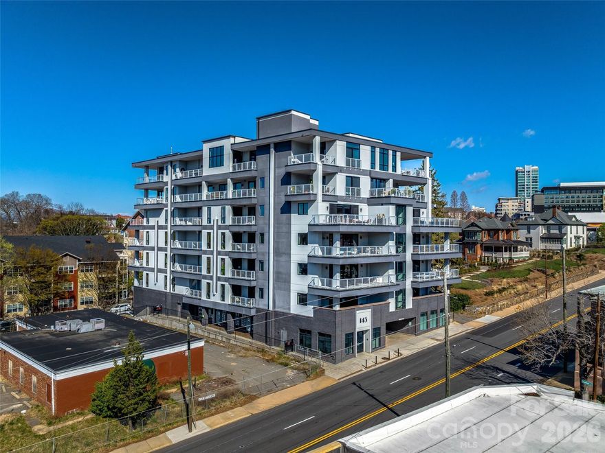 6TH FLOOR UPTOWN VIEWS & MT PISGAH! Experience modern mountain luxury in the heart of vibrant Downtown Asheville from this first-time offered, north-facing home with unobstructed views of Uptown Asheville. This two-bedroom split plan/two full bath condominium at 145 Biltmore offers stunning uptown and mountain views from the 6th floor. Enjoy a spacious wraparound balcony/deck plus two Juliette balconies, perfect for soaking in the scenery, including Mt. Pisgah. Imagine the Downtown twinkle of lights, mountain views, and overlooking some of Asheville's most historic homes. The well-designed open-concept layout features one-level living, a private primary suite, dining area, generous storage, and one gated garage parking space—rare in downtown. Step outside to Asheville’s finest restaurants, breweries, shops, arts, and entertainment. Luxury, location, and lifestyle await! An additional parking space is available if desired.