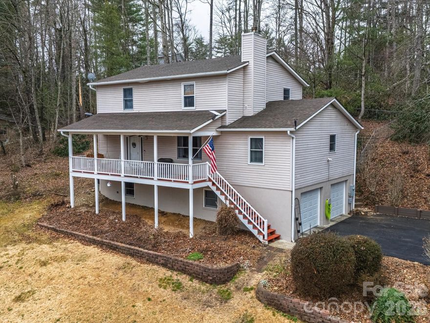 Tucked away in a private and quiet area as the only home in the cul-de-sac of Byers Park, this beautiful Fairview home is ready for its next chapter! Whether you’re envisioning a full-time residence, short-term rental potential, or the perfect mountain getaway, this home delivers the kind of versatility you’ve been waiting for. Imagine morning coffee on the covered front porch appreciating the year-round mountain sunrise views, gardening in the sunny yard, or relaxing on the private back deck. Step inside to discover a generous, free-flowing floor plan that moves effortlessly from the living room to the kitchen and dining area, providing a welcoming environment for both quiet mornings and hosting guests.
With a main-level primary suite and a second primary suite upstairs plus two additional bedrooms, there is ample space for everybody. The upstairs primary bedroom also features a unique private balcony, perfect for al fresco dining. Downstairs, a den and bonus room allow for a variety of uses including a home office, media room, playroom, or art studio. 
Practical features such as a laundry room and half bath on the main floor and extensive storage throughout the home help ensure a seamless daily routine. 
A spacious two-car garage adds extra storage for outdoor hobbies and decorations. Outside, the fenced backyard provides a blank canvas for gardening, outdoor recreation, or evening gatherings. A separate storage shed adds more utility for outdoor hobbies. 
This home is perfectly positioned just minutes from popular destinations like Whistle Hop Brewing, Turgua Brewing, and Daymoon Coffee. Easy access to the Blue Ridge Parkway puts world-class scenic drives, hiking, and outdoor adventure within minutes for the true nature enthusiast. A short drive connects you to the electric energy of Asheville or the charming small-town feeling of Hendersonville. Schedule your visit to this versatile mountain home today!