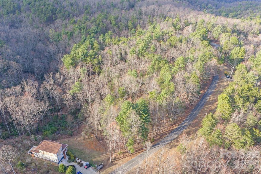 Build your mountain getaway in the gated Pine Mountain Lakes community of Connelly Springs. This 0.47-acre wooded lot on Holly Road offers a peaceful setting surrounded by the natural beauty of Burke County’s South Mountains region. The property provides an opportunity to build within an established mountain community known for its scenic landscape and access to outdoor recreation.

Pine Mountain features miles of walking and hiking trails throughout the community and is located near South Mountains State Park, offering additional opportunities to explore nature. Conveniently located within driving distance to Hickory, Morganton, and surrounding foothill towns for shopping, dining, and everyday essentials.

Whether you're looking to build a primary residence, mountain retreat, or investment property, this lot offers a great opportunity to own land in a private mountain community.
