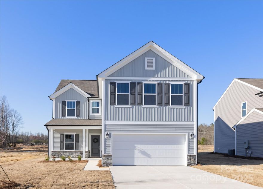 This stunning 4-bedroom, 2.5-bathroom home nestled in the heart of Pageland, SC, offers a spacious open floor plan with thoughtful upgrades throughout. The main level features a private study, a large great room that seamlessly connects to the dining area and kitchen, perfect for both relaxation and entertaining. The kitchen is equipped with stainless steel appliances, a generous pantry, quartz countertops, and a stylish tile backsplash. Upstairs, the oversized primary suite includes an ensuite bath and a walk-in closet, creating a luxurious retreat. A versatile loft area, laundry room, and spacious secondary bedrooms complete the second floor. Home features a spacious backyard and a front porch. This home offers the ideal blend of comfort, functionality, and modern design.
