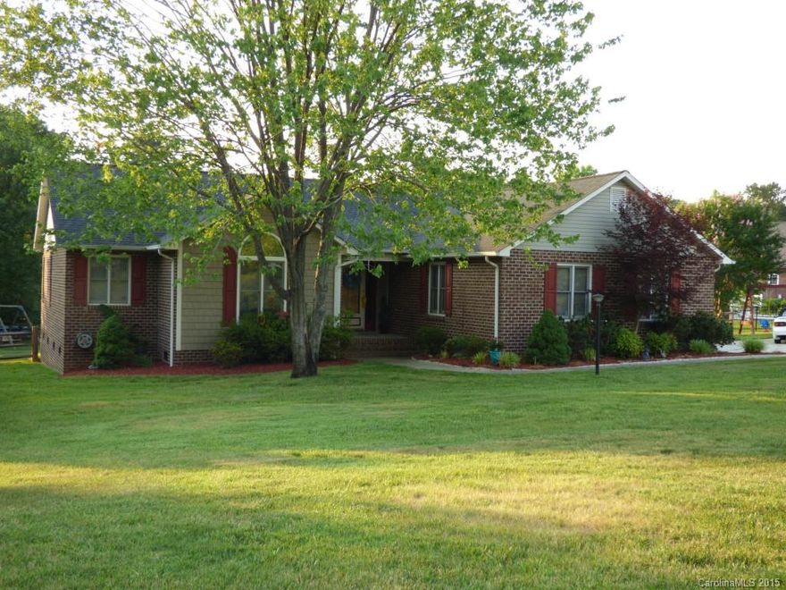 Immaculate brick ranch home on almost one acre complete w/ fenced backyard and both an attached oversized 2 car garage and awesome detached 3 car garage workshop with 220 power and generator hook up to power the entire house!  The yard is like walking through a mini Biltmore garden exploding with color in the springtime.  Take it all in from the large Gazebo on the back deck or move inside to enjoy the open/airy great room w/ beautiful fireplace.   Country living at its finest!  MUST SEE NOW!!