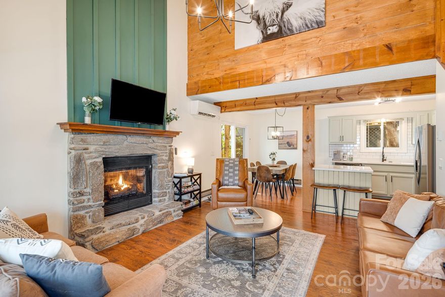 Gorgeous, updated mountain cottage located in the heart of Maggie Valley, offering charm, character, and a picturesque setting. Enjoy peaceful mountain living from the inviting front porch while listening to the soothing sounds of the mountain stream that runs along the side of the property.
The interior features a stunning two-story great room with a stone fireplace that opens to the breakfast nook and kitchen, creating a warm and welcoming space for gathering. Extensive interior updates throughout include accent walls, painted kitchen cabinets, white quartz countertops, large kitchen sink, stainless steel appliances, and beautifully updated bathrooms.
The home offers excellent outdoor living space—perfect for relaxing by the fire or enjoying games and entertaining. Conveniently connected to county water and sewer.
Ideally located near all the conveniences of Maggie Valley, Waynesville, Cataloochee Ski Area, and the Blue Ridge Parkway. This property is a prime opportunity and is currently a successful short-term rental. Being sold fully furnished, including all appliances, meticulously maintained - making it completely turnkey and move-in ready. Recent price repositioning enhances the value of this exceptional mountain home.