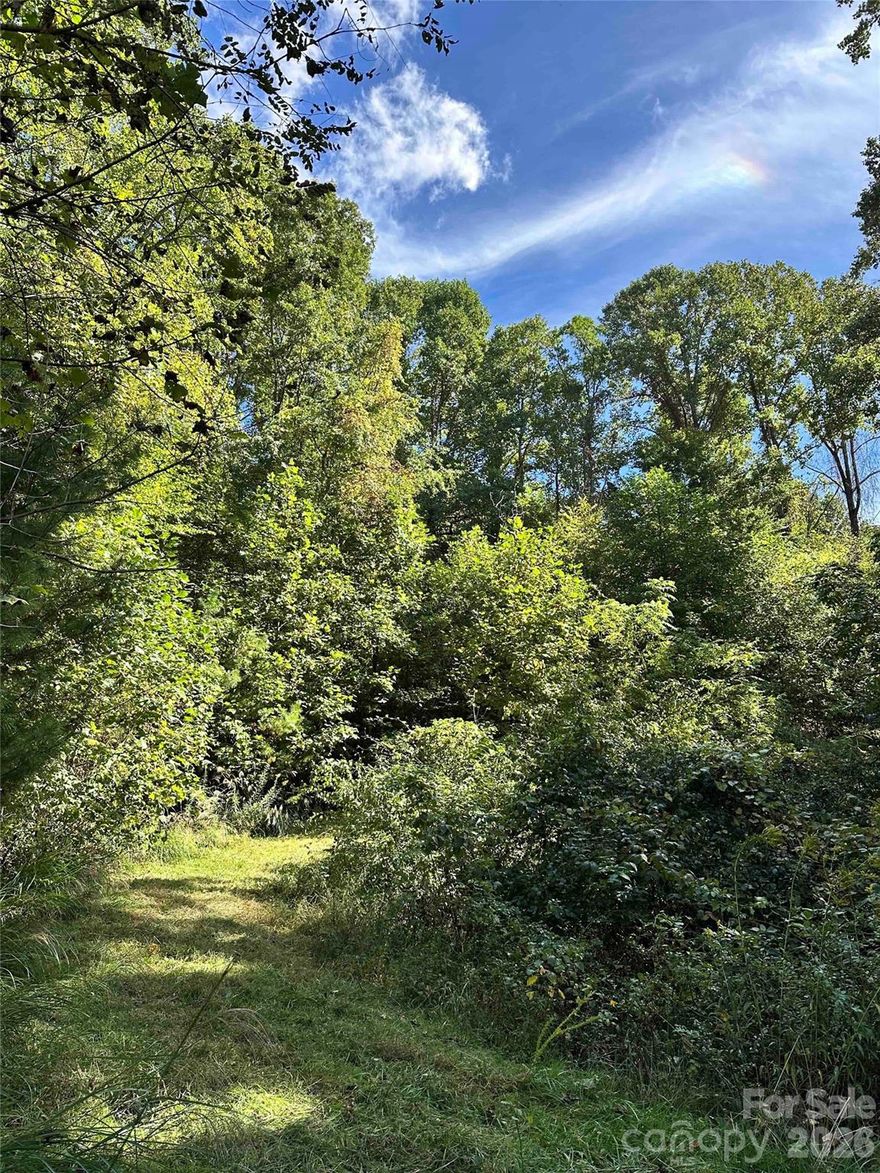 The land is located in the section of the neighborhood that is considered Madison County, which has lower property taxes than Buncombe County. It includes 2 adjacent lots (with only 1 HOA fee). Lot 188 offering potential for long-range mountain and western sunset views (if some trees are cleared), and lot 198 offering a secluded setting in the woods or a place for an additional dwelling. You can also split the lots and sell the other in the future. Both lots are ideal for building compared to others in Seven Glens, which have very steep slopes. The land is situated on a cul-de-sac. There is a driveway cut already on lot 188 with the potential view, and a septic permit included as well. Lot 188 also has a cleared area at the top of the drive and provides the perfect amount of immersion in the woods while also having good air flow and light. You have the option of building down from the road on the back end of the lot, which is usually more cost-effective. Utilities are underground on both lots, and you have the option of a well or catchment for water. A great start to a home build project! Located in the Scenic community of seven Glens this lot is easily accessible and very buildable! A perc test has already been performed on the property. 
Financially, Seven Glens maintains a healthy balance to be used primarily for our private roads and grounds maintenance. Recent improvements include a repaving of several miles of roads and beautification of the main entrance. Seven Glens Homeowners Association does not own any communal properties.
Located as we are, the area is rich with a range of activities for people of all interests. Residents enjoy golfing at the many courses throughout the area, as well as fishing, hiking and other outdoor activities. The Appalachian Trail and the Blue Ridge Parkway are a short distance away. Asheville and Weaverville offer a range of restaurants and night life options, The greater area also boasts an abundance of churches of all faiths.
Seven Glens has covenants designed to keep the community an attractive and appealing place in which to live. Through our Architectural Review Committee, we also have guidelines for building and remodeling. All positions of governance at Seven Glens are volunteer positions.