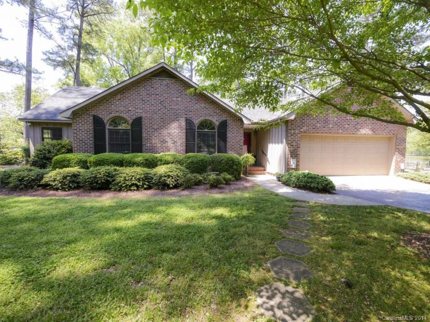 Beautiful lake front home on level lot. Screened porch overlooking the water, dock and deep water.  2 car attached garage and an additional 1 car detached garage/workshop space. First time home has been on market, original owners, very well maintained property, freshly painted interior, hardwood flooring and spacious master bath are just a few of the benefits offered. Great room w/raised hearth fireplace and flanked by new French doors leading to deck. This is gorgeous lot with beautiful vistas.