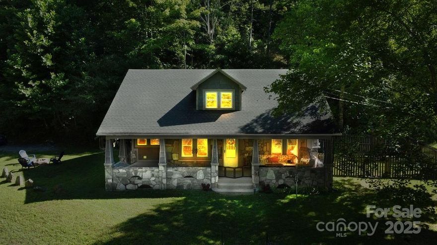 Come see this Charming Home in the mountains! Beautiful Stone covered 2 Bedroom 2 Bathroom home with modern updates.  Enjoy the peaceful sounds of nearby Dicks Creek from anywhere on the property.  Sitting on the front porch admiring the views of High Top Mountain. Down across the road is the Tuckasegee River with class 2 rapids and world class trout fishing. Ideally located 5 minutes from Dillsboro, 9 minutes from Sylva and only 15 minutes from Cherokee and the casino. Large 1-1/3 acre yard to enjoy. Large red maple in the front, an apple producing tree and white rose bushes all around.  The home is a delight combination of old charm and modern updates.  The kitchen and bathrooms are updated and spacious.  Live on vacation everyday in this beautiful home!