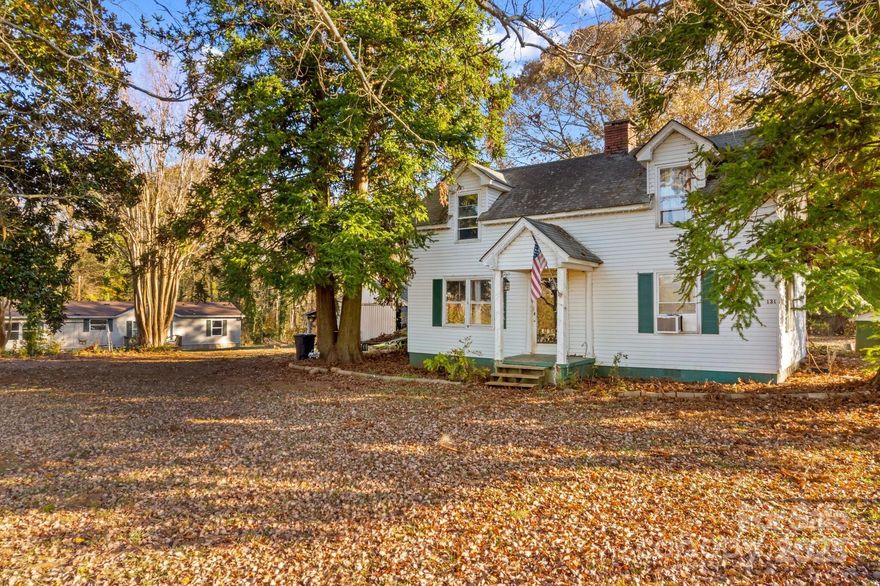 MOTIVATED SELLER! CASH ONLY - SOLD AS-IS; Perfect Investment Property!! Experience country living complete with a classic white picket fence! This 1.57-acre parcel offers two separate living quarters, perfect for multi-generational living or investment opportunities. The charming 1940 farmhouse features 2 bedrooms and 1 bathroom on the main level, a spacious living room with a brick fireplace, and an open kitchen and dining area. The unheated upper level provides two additional bedrooms with lower ceiling heights. Step outside to a relaxing deck that overlooks the 661 sq ft detached garage and the above-ground pool. The second residence is a 2001 manufactured home offering approximately 1,500 sq ft with a split floor plan, 3 bedrooms, 2 full bathrooms, a kitchen with breakfast area, dining room, and a generous living room.  Each dwelling has its own septic system; the farmhouse is connected to city water, while the manufactured home operates on a private well. The parcel may have potential to be split, and an additional 1.76-acre lot is available for purchase separately.  Sold As-Is.  Schedule your showing today!