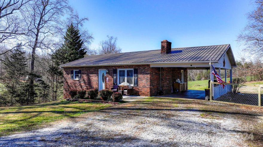 This 3 bed, 2 bath, Brick Ranch on almost a full acre has SO much to offer! Conveniently located between Hickory and Morganton, this charmer boasts gorgeous views, a spacious back deck, and a walk-out basement. Inside, you will find updated everything! Freshly painted kitchen cabinets, LVP flooring, all new fixtures, and so much more! A newer HVAC (2018) and updated windows, a stunning metal roof, and fresh paint throughout, this little gem has left no stone unturned. Enjoy privacy, plenty of outdoor space, an attached carport, plus an unfinished basement with endless possibilities and a full bathroom already complete! Come see 5944 Miller Bridge today and make this beautiful house "Home".