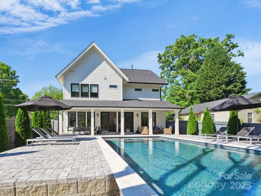 Discover the perfect blend of style, comfort & location in this stunning modern home nestled in the vibrant Belmont neighborhood... just steps from local favorites like Sweet Lew’s BBQ, Ace No. 3 & the Little Sugar Creek Greenway. Step inside to a bright, open floorplan designed for today’s lifestyle. The living room features a gas fireplace & flows seamlessly into the chef’s kitchen with custom cabinetry & ample space for entertaining. Wide-plank hickory flooring runs throughout the home, adding warmth and character to every room. The spacious primary suite is a private retreat, boasting a luxurious bath and thoughtful finishes. A vaulted bonus room provides the perfect space for a home office, media room or guest retreat. Out back, unwind on the expansive covered porch overlooking your saltwater pool & hot tub—an entertainer’s dream and a serene escape in the city. Enjoy seasonal views of Uptown Charlotte while tucked into one of the city’s most sought-after in-town neighborhoods.