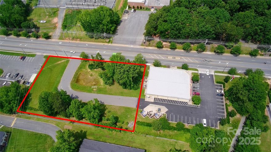 RARE OPPORTUNITY TO OWN COMMERCIAL LAND IN BOOMING EAST CHARLOTTE. This ±1.371-acre site offers ±300 FT of frontage on MILTON RD and shares a paved access drive with Family Dollar. WATER & SEWER AT THE PROPERTY LINE. Near-development-ready and surrounded by rooftops, this lot sits just off N SHARON AMITY and minutes from WT HARRIS BLVD and EASTWAY DR. Zoned for commercial use and perfect for long-term hold, land banking, or future development. NO HOA, NO FLOOD ZONE, and EASY TO MANAGE. Investors love this area for its growth, affordability, and stable demand. SITE PLANS AVAILABLE—BUY NOW AND HOLD FOR THE FUTURE.