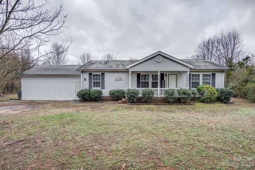 Come see this private and secluded property! A long gravel driveway leading to the home, which is located back off the road. The home is a 3 bedroom, 2 bathroom and sits on a nice level lot with woods around it. There is a large fenced in backyard with a storage building. The home has a nice front porch leading into the open living area with a fireplace. Newer flooring in the living room, dining area, and primary bedroom. A spacious primary bedroom and a large primary bathroom. The kitchen has a good amount of cabinet space. The laundry room is just off the kitchen. The enclosed carport has extra flex space with two separate rooms. It is heated and cooled by mini splits, which are approximately 3 years old. The rest of the home has central HVAC. This property has a lot to offer and is convenient to Highway 216 and 74.