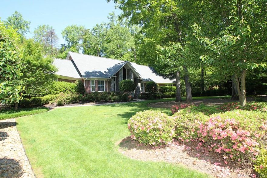 This beautiful golf course, cul-de-sac home is loaded with updates!  The gourmet kitchen is to die for, the great room is vaulted with hardwoods & stacked stone fireplace, huge owner's suite with pool/patio access, huge owner's closet and private home gym/office, amazing Infinity Pool with Hot Tub waterfall, oversized tile patio, fenced wooded lot,& is on the 14th Fairway of River Hills CC.  Community is located just inside SC with low taxes, great schools and close proximity to Charlotte!