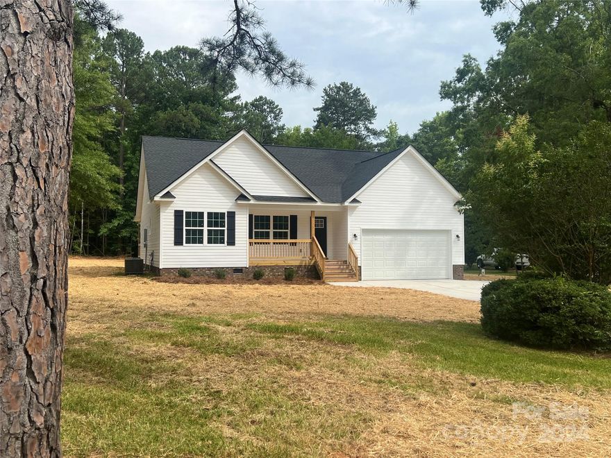 New Home Outside City Limits. 3 Bed two full bath. LVP in living areas and carpet in bedrooms. Well and Septic. Split Bedroom Plan. Covered rear porch. Finished Garage with opener. Concrete Driveway. Primary Bedroom has walk in closet and double vanity.