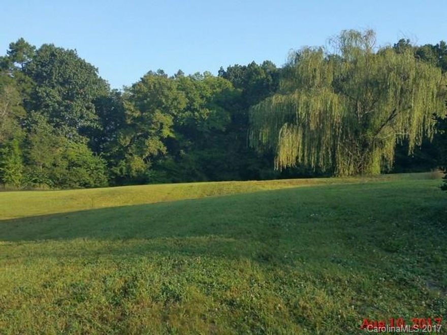 Lovely 2 acre parcel,  Well and septic on the parcel, condition of both unknown.  Parcel previously had a 3 bedroom 2 bath room home with a basement on it.   Home burnt down.  Access to Parcel is a 45 ft access right of way according to the deed.   See attachment for PAS requirements and WFHM offer submittal information in MLS document section.  It is unknown if there are any restrictions or minimum building size  requirements. According to a neighbor the septic system is under the Willow Tree.