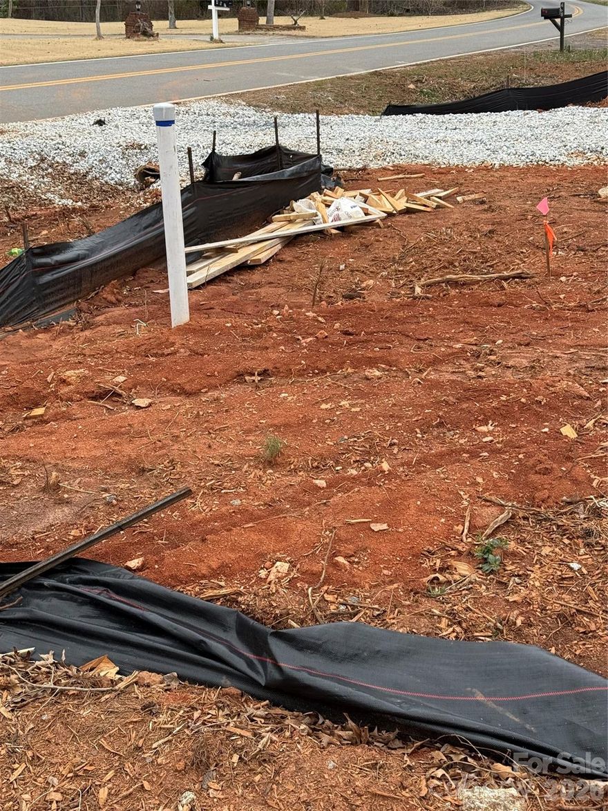 Almost 1/2 acre cleared lot with 4 bed septic permit!

Can build to suite or pick one of our plans OR build yourself.  This lot is ready to build!