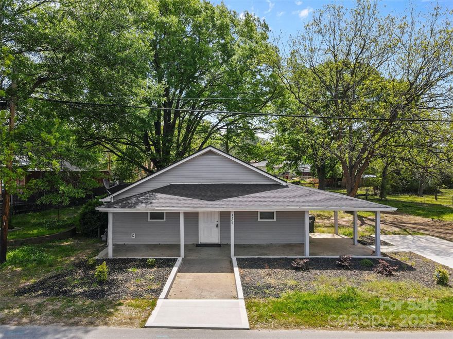 Welcome to 4304 S. Falls Street, a beautifully updated 3-bedroom, 2-bathroom home offering 1,344 square feet of comfortable living space. Situated on a spacious 0.37-acre lot, this residence combines classic charm with modern amenities.

Originally built in 1930, the home has undergone extensive renovations, including new luxury vinyl plank flooring, updated electrical and plumbing systems, energy-efficient windows, a new water heater, and fresh siding. The open-concept floor plan features a modern kitchen with white cabinetry, perfect for contemporary living.

Enjoy relaxing on the inviting covered front porch, ideal for rocking chairs and morning coffee. The secluded yard provides a peaceful outdoor retreat, complemented by a convenient carport and additional driveway parking.

Located in the South Gastonia neighborhood, this home is close to local schools, shopping, and dining options.

Per seller, property sold as is.