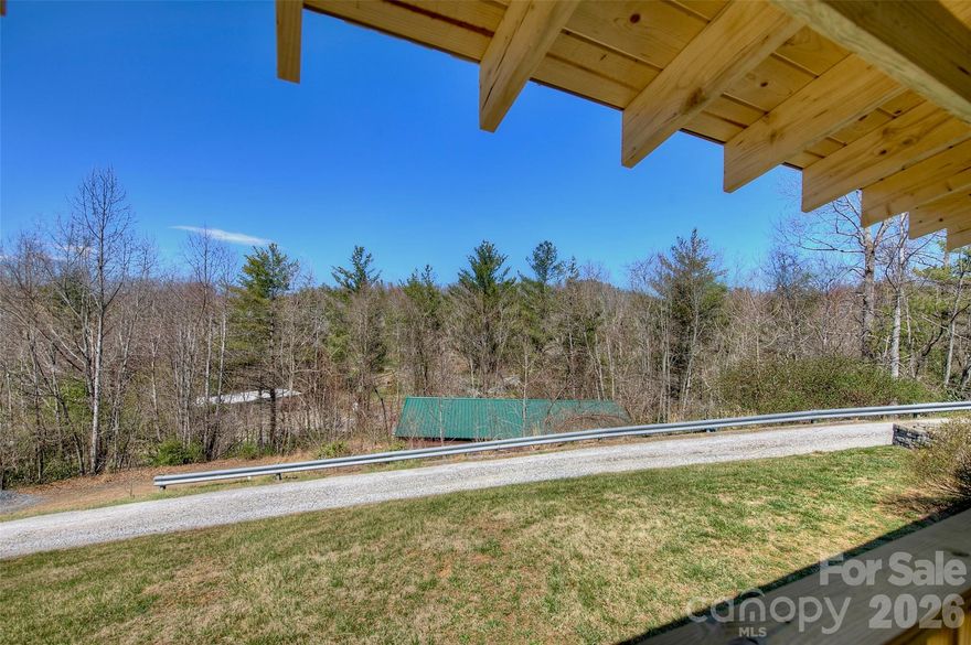 6.04 unrestricted, developable acres offering endless opportunity & income potential. Well-maintained 1999 3BR/3BA on-frame modular home (1,952 sq ft) features private well, city sewer, open floor plan, expansive living areas, grand master suite w/ dual full baths, huge walk-thru closet, gas logs, island cooktop, ample cabinets/counter space, central HVAC, large covered porch w/ mountain views, adjacent carport & utility building.
Recent updates: Roof (2020), well pump (2024), garage doors & front door (2025).
Key outbuildings & features:

1,440 sq ft fully insulated master workshop (engineered metal bldg by New Horizon, 150 mph wind-rated, industrial epoxy floor w/ expansion joints on 5,000 PSI concrete, (2) 10x8 ft doors opposite sides, 200A service, water/sewer hookups ready, interior bath & sink plumbing installed)
1,008 sq ft additional building (convertible to home)
Separately metered lot for camper/single-wide (income potential)
Large chicken coop/run & poultry cage; additional pen section ready to assemble
Old dynamite/survival bunker (ideal for cellar/storage)
Fruit trees, ample space for gardens/expansion

Private gravel drive leads to secluded mountain setting just outside Spruce Pine, NC—1 mile to Blue Ridge Parkway.
Prime location for mountain living:

1 min to BRP
3 min to downtown Spruce Pine, Blue Ridge Regional Hospital, new state-of-the-art gym/indoor pools
5 min to Walmart Supercenter
6 min to Grassy Creek Golf & Country Club
8 min to Penland School of Crafts
10 min to Linville Falls Winery
15 min to Burnsville
20 min to Grandfather Mountain State Park or Linville Falls
30 min to Lake James (fishing/water sports), Marion shopping, I-40
30 min to Banner Elk, Beech Mountain, Sugar Mountain (skiing, fine dining, Mountain Glen GC)
50 min to Asheville
60 min to Johnson City, TN & Tri-Cities Airport
2 hrs to Charlotte

Perfect for mini-farm, multi-unit rentals, vacation/retirement retreat, hobbyists/toy storage, or outdoor enthusiasts. Enjoy scenic daily drives, world-class mountain beauty, recreation, and welcoming communities!