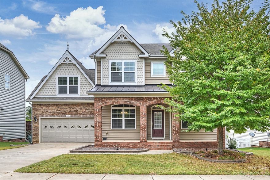You will be amazed with the open floor plan in this 2-story home! Soaring Great Room with large windows and fireplace is the focal point that opens to gourmet kitchen w/stainless steel appliances, granite counter tops, tile backsplash, breakfast bar, desk/computer niche & breakfast area. Perfect for entertaining! Huge primary bedroom suite w/sitting area overlooking the backyard is on main. Primary bath features large walk-in closet, garden tub, dual sink vanity, tiled shower & private water closet. Large formal dining room with tray ceiling & wainscoting. French doors lead to living room/flex room with lots of sunlight. Hardwoods throughout most of main. You'll love the upstairs that overlooks Great Room with 3 large bedrooms, Jack & Jill bath, another full bath and large 19x17 bonus room. Enjoy the private backyard from your deck which has an electric awning or relax on the paved patio that surrounds the custom stone firepit. Short walk to the community pool, playground & clubhouse!