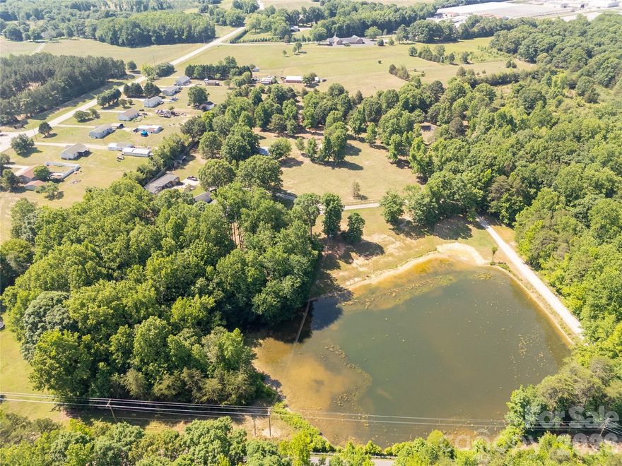 Country living! 16.40 acres total on 2 parcels overlooking a beautiful pond! Morning rides, pondside sunsets, and the privacy of wooded buffers define the lifestyle here. The two-tract configuration provides flexibility for immediate use and future expansion while preserving privacy.

So many possibilities and located between Clover and York, SC. Features include remodeled 2 bed/ 2 bath ranch, detached 2 story workshop/flex building and an additional home that is waiting for your vision and personal touch! Bring your animals to the 3 stall barn and fenced pastures. 

If you are seeking a property for an Equestrian estate, hobby farm, or multi-generational living, this is the one for you! Schedule your showing today!