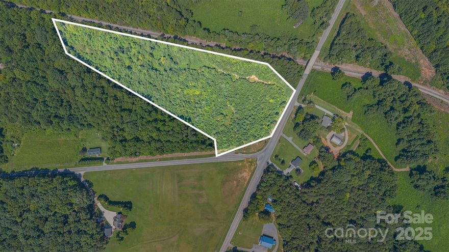 Discover an exceptional opportunity to own 8.7 acres of beautifully wooded, residentially zoned land at the corner of Slanting Bridge Rd and Sherrills Ford Rd in Sherrills Ford, NC. This prime parcel, part of a larger 16+ acre tract, can be a great opportunity for a small subdivision or could possibly be re-zoned commercial for a shopping center or other use. There are some commercial lots that surround this property and are near by.  Surrounded by mature trees, the property provides a natural escape while being conveniently located just minutes from stores, restaurants, and supermarkets. With easy access to Routes 16 and 150, commuting and connectivity are a breeze. Don’t miss your chance to secure this versatile and well-positioned lot in a growing community!