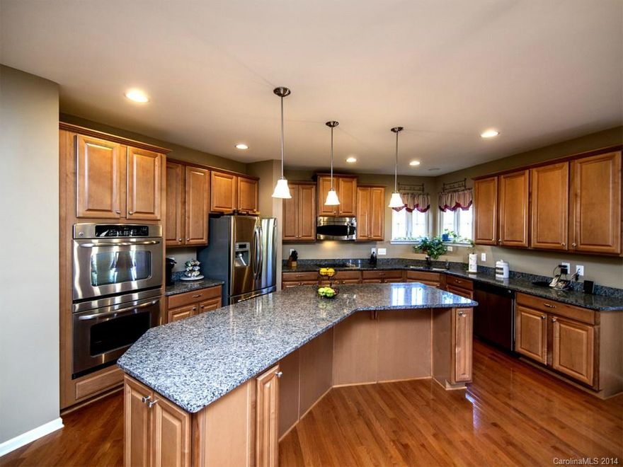 Wonderfully large home with upgrades through-out; Hardwood flooring leads the way to Elegance; Gourmet Kitchen features oversized island, granite, double ovens, smoothtop electric cooktop, enormous walk-in pantry.  Large butler's pantry adjacent to oversized dining room.  1st floor BR with 1st floor BA; Den is adjacent to the kitchen-great for entertaining or talking to the chefs while they are cooking. True Bonus on 2nd; Bonus or 6th BR on 3rd floor & full bathroom: Generous amounts of space