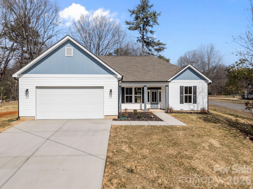 Brand new construction at 2105 Fowler St in Kannapolis! This thoughtfully designed 3BR/2BA ranch offers a split-bedroom floor plan and 2-car garage. The open-concept great room flows seamlessly into the dining area and kitchen, ideal for everyday living and entertaining. The private owner’s suite features an ensuite bath, while two additional bedrooms share a full bath on the opposite side of the home. Enjoy a covered front porch, rear patio, dedicated utility room, and extra storage. Conveniently located near shopping, dining, and commuter routes.