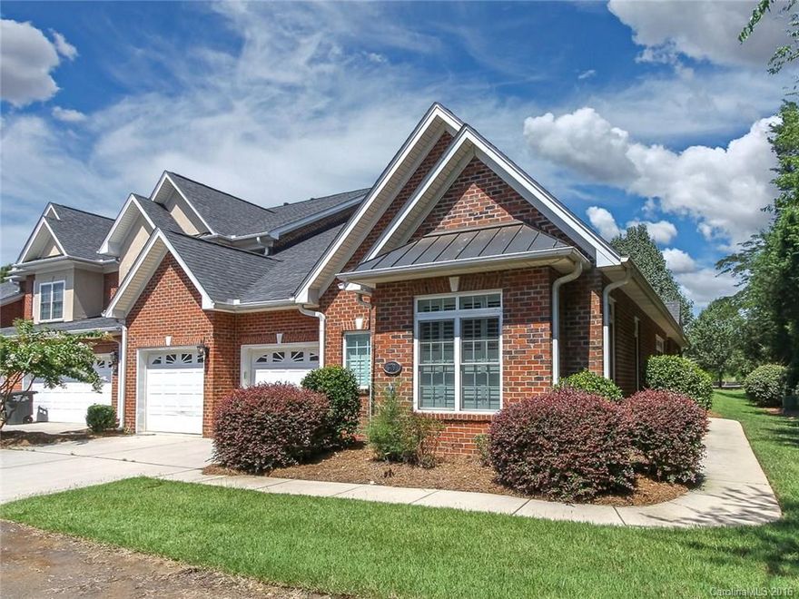 Awesome town home with gorgeous brick exterior and gated community.  Open kitchen, SS appliances, great storage. cute breakfast nook, also has formal dining area. Huge master bedroom with walk in closet.  Master bath has double sink.  Massive great room with beautiful built ins, gas fireplace for those cozy nights.  Whole house is bright and cheery. Back patio perfect for grilling and relaxing! Move in ready! End unit, Come & see this home with great amenities and  low HOA's This won't last long