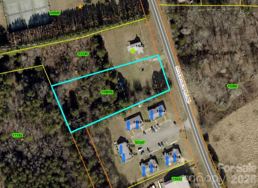 Build your dream home on this spacious 1.35-acre lot offering the flexibility to create the lifestyle you envision. With county water available and minimal restrictions, this mostly level parcel provides an ideal setting for a custom site-built or modular home. The back half of the lot is dotted with trees, offering natural beauty and shade, while a wooded buffer along the left side creates a sense of privacy from neighboring property. Whether you're looking for open space, room for a garden, or simply a peaceful setting to call home, this property offers a great blend of opportunity and convenience.  This lot includes the former driveway to the house on right.