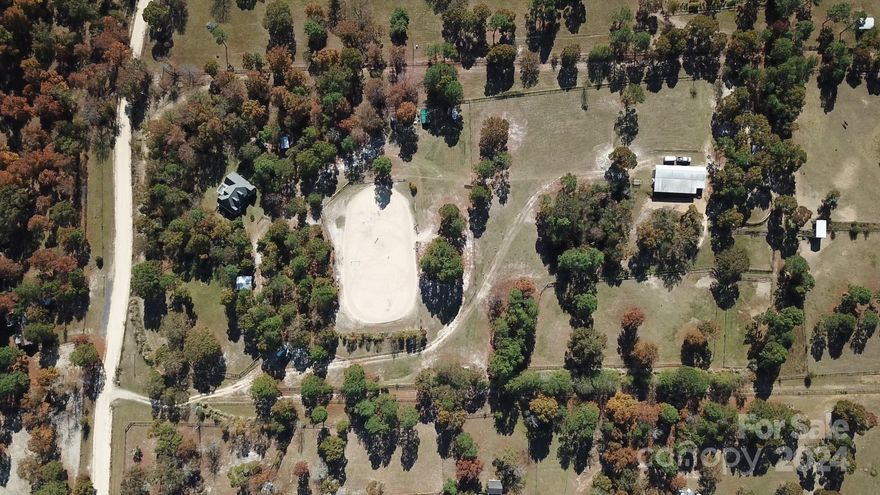 Welcome to your dream equestrian estate in picturesque Camden.This exquisite property offers over 1800 square feet of comfortable living space with 3 bedrooms, 2 full baths, a bonus room, and ample storage.Situated on over 14 sprawling acres, it's a haven for horse lovers and those seeking a peaceful country lifestyle.The open floor plan seamlessly connects the living room, dining area, and kitchen, creating a welcoming and cozy atmosphere. The large windows allow natural light to fill the space.A 10-stall horse barn, complete with a tack room and its own septic system. Five paddocks and a fully fenced arena allow your horses to roam freely and graze in a safe environment.Your equestrian journey continues with a track that encircles the property. You'll have easy access to a supportive equestrian community and endless riding opportunities. Don't miss the opportunity to make it your own.