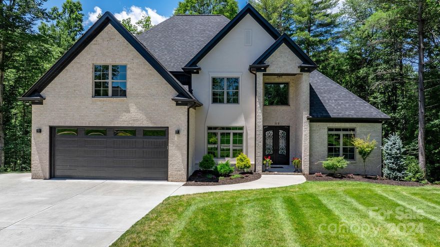 Welcome to this exquisite modern masterpiece, nestled in the coveted community of Moore's Ferry! Embodying the epitome of luxury+comfort & nestled on a picturesque lot, this 2-story home w/basement features 5-beds and 4-baths. This gem is surrounded by lush landscaping, complemented by Hunter irrigation & built-in exterior landscape lighting. Step inside through the custom iron double front doors & be greeted by soaring ceilings, modern light fixtures, & a breathtaking stone floor-to-ceiling fireplace. The open-concept layout flows seamlessly into the kitchen, featuring custom cabinets, stainless steel appliances, sleek quartz countertops, and a large central island. The primary suite offers a spacious walk-in closet and a luxurious en-suite bath with marble tile flooring, a walk-in shower, and a freestanding soaking tub. With this homes impressive features, exceptional location, and desirable neighborhood don't miss out on seeing firsthand the beauty and elegance that awaits you!