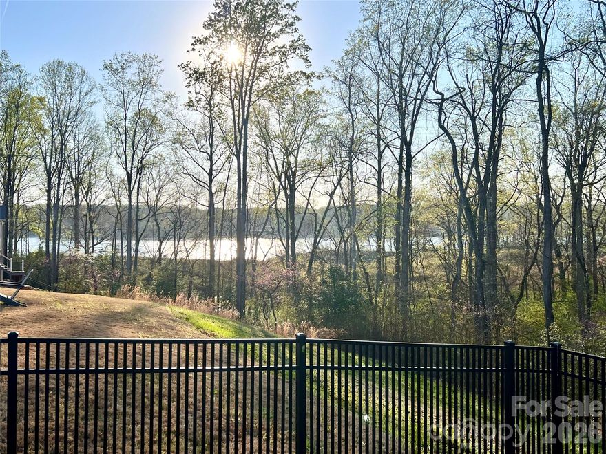 Better than new!! Home built in 2023, with stunning water views—this one truly stands out. Enjoy peaceful lake views from the kitchen, living room, and screened porch, creating the perfect everyday retreat. This thoughtfully designed one-story home features a bright, open layout with a gorgeous kitchen showcasing a gas cooktop, modern finishes, and neutral paint throughout. The spacious primary suite offers a spa-like tiled shower and a relaxing escape at the end of the day. Step outside to a private, fenced backyard—rare for the area—perfect for entertaining, pets, or simply enjoying the view. The covered front porch is ideal for rocking chairs and quiet mornings. Located in a sought-after community with lake access, sports courts, two pools, and a brand-new clubhouse underway, this home combines lifestyle and convenience. Low-maintenance house and a two-car garage complete the package. If you’re comparing options, the water views and fenced yard truly set this home apart.