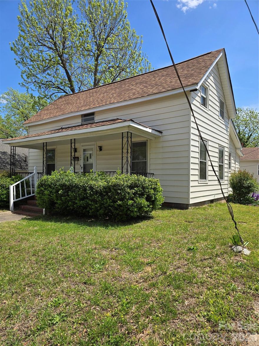 Rare opportunity in the heart of Concord featuring a unique dual-dwelling setup at 184 Cabarrus Ave E. The main home offers 4 bedrooms and 1.5 bathrooms with hard flooring throughout, a functional layout, and a covered front porch. The property also includes a separate 1-bedroom, 1-bath apartment located at 182 Cabarrus Ave, approximately 480 sq ft, featuring a kitchen, living area, bathroom, closet space, and abundant natural light. The apartment is located above a detached garage currently used for storage, offering added flexibility. Both units are included in the sale for a combined price of $333,000, presenting excellent potential for owner-occupancy, multi-generational living, or rental income.