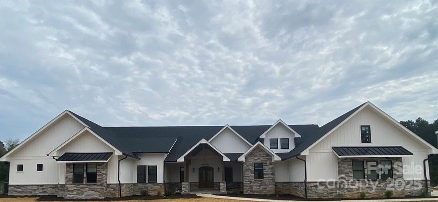 Exquisite Private Estate on Over 30 Acres!!!

Welcome to a world of unparalleled luxury and privacy. This magnificent custom-built estate offers a truly rare opportunity to own a sprawling retreat on 30.47 acres of pristine, secluded land. Designed for the discerning homeowner, this residence boasts over 7,000 square feet of meticulously crafted living space.

Step inside the grand entrance and discover a home built for both elegant entertaining and comfortable family living. The home boasts 4 bedrooms on the main level providing ample space for family and guests. Each room is a testament to the home's quality, featuring bespoke finishes, soaring ceilings, and an abundance of natural light. 

The heart of the home is a gourmet kitchen, a chef's dream with high-end appliances, custom cabinetry, a butler's pantry and double islands perfect for gathering. Flow seamlessly from the kitchen to the expansive living areas, which offer breathtaking views of the surrounding landscape. Imagine hosting memorable gatherings in one of the home's many inviting spaces; the fireplace in the two-story great room, the lavish trex deck off the main level, or the basement level patio.

The primary suite is a private sanctuary; a luxurious retreat designed for ultimate relaxation. It features a spa-like ensuite bathroom with a soaking tub and an expansive walk-in closet. The primary suite features its own private office. The additional bedrooms are generously sized, each offering comfort, generous storage, natural light and privacy.

The lower level of this estate is as impressive as the main floor, offering a finished basement with endless possibilities. A cozy den with a fireplace creates an inviting atmosphere for movie nights or quiet evenings, while a dedicated media room is ready for the ultimate cinematic experience. For added security and peace of mind, a safe room with a vault door is perfect for storing valuables. This level also features an additional office, a dedicated exercise room for your personal gym, and versatile flex space that can be customized to suit your lifestyle.

Beyond the main residence, this 30+ acre property is a canvas for your dreams. The vast, private grounds provide endless possibilities, from creating a private equestrian facility or a family compound to simply enjoying the tranquility of your own natural oasis. This is more than a home; it's a legacy property, a place to create a lifetime of memories in complete seclusion.

Don't miss the chance to experience the epitome of luxury living. Schedule your private showing today and discover this one-of-a-kind estate.