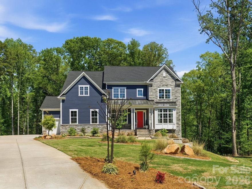 This is your dream backyard! Situated at the end of a cul-de-sac in one of Fort Mill’s most sought-after communities, this 1.72-acre property offers a fully fenced backyard surrounded by mature trees with a heated pool and spa and an abundance of yard. This beautiful home offers over 5,300 square feet with a finished, walk out basement. Formal dining perfect for entertaining/holidays, a separate dedicated office space and a main level guest ensuite that has access to their own laundry. Tons of natural light throughout. Great room with custom built-ins is open to beautiful white kitchen featuring quartz surfaces, gas cooktop, wall oven and breakfast that opens to screen porch. Upstairs, the primary suite is generously sized and features a relaxing bath retreat with new quartz counters, large walk in shower, soaking tub, and ample closet space. The secondary bedrooms are well laid out, including a Jack and Jill bath, an additional ensuite bedroom, and huge bonus. The upstairs laundry room includes custom built-ins and a utility sink. The finished basement expands the home with a large recreation space, kitchenette, storage, and a flex room currently used as a gym but could be 6th bedroom. This home's floorplan offers several options for extended stays or multi-generational living. Homes with this combination of lot size, setting, and livability are hard to find!