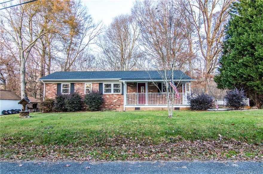 Charming remodeled brick ranch in a private country setting! Located off Mt. Holly Huntersville Rd. just outside Huntersville on a dead end street that backs up to Mt. Island Lake. New roof, well tank, septic system, windows & master bath. Updated kitchen, den & refinished original hardwood floors. Loads of exterior space. Rock on your front porch, entertain on the patio, or swing on the gazebo. Minutes from Northlake, 485, 77, and 16!