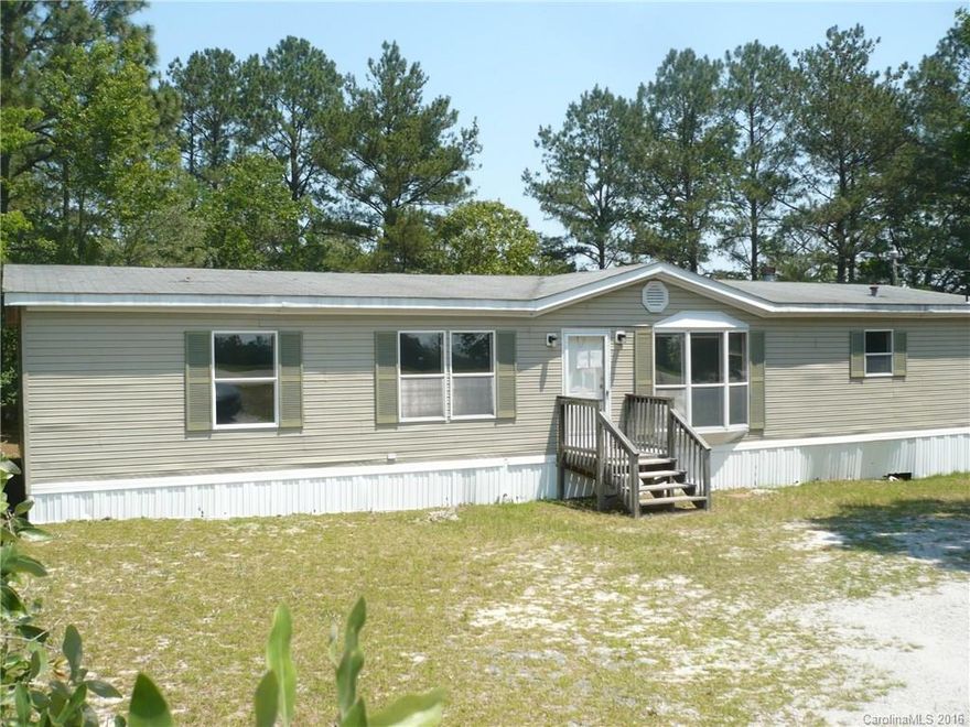 Doublewide mobile home on a 2 acre lot, home features 3BR, 2BA, large family room, nice size master and master bath. Sold “As Is”.