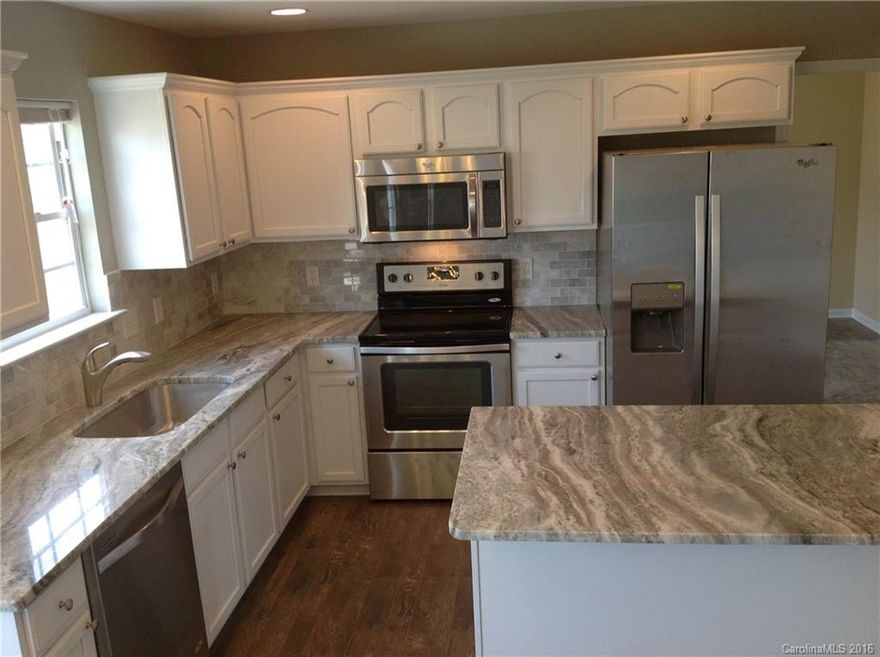 Totally renovated 5 bedroom 3 full bath home on great street in Steele Creek.  New Stainless appliances, granite, marble back splash, wood laminate flooring, carpet, lighting, the list goes on and on.  Shows like new construction. Convenient access to I-485, and the new Premium Outlets, Uptown, Airport and Lake Wylie!