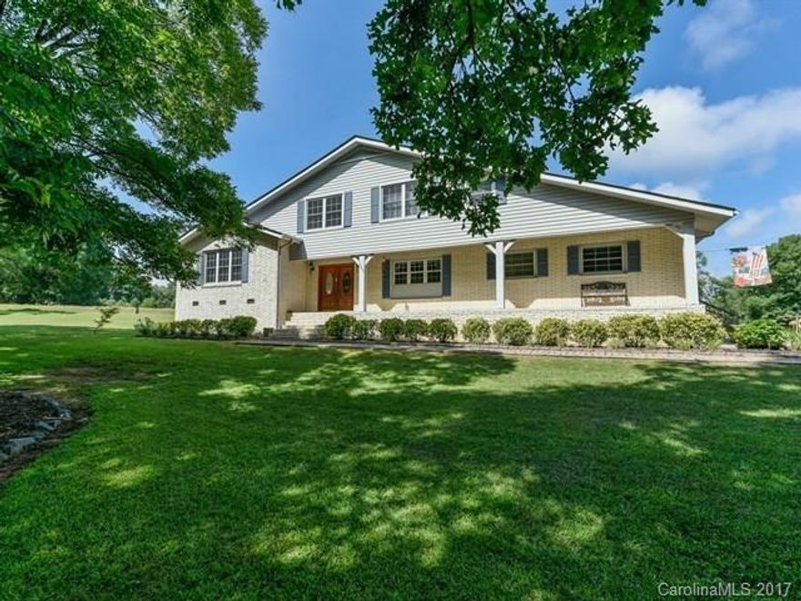 Country Living at its finest but convenient to Ballantyne and Carolina Place Shopping and Restaurants. Awesome custom brick home on over 3 ac. This home boasts a Chef's Dream Kitchen, w/new appliances.  The 4 bedrooms are huge w/ lots of storage. 2 Master bdrms, One on the Main-Level. Sunroom, fruit & nut trees.  Perfect for a Garden or could fence for horses. Lots Outside storage. Beautiful large shade trees. Possible B&B?  Not a Cookie-Cutter home.  This home has personality and character!