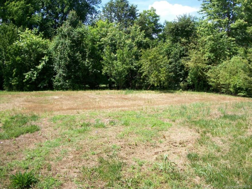 THIS IS A NICE LEVEL LOT. BOUNDED BY BROOKSHIRE FREEWAY TO THE NORTH,  ROZZELLES FERRY RD.
TO THE SOUTH,  WEST TRADE ST. TO THE WEST  AND BEATTIES FORD RD TO THE EAST. 
CLOSE TO UPTOWN.
THE TAX VALUE (FROM TAX RECORDS 7/2013) IS FOR THE LAND ONLY. THE HOUSE WHICH WAS PREVIOUSLY ON THE LOT WAS DESTROYED BY FIRE. AND THE TOTAL PARCEL ASSESSMENT IS 
"UNDER REVAL.  REVIEW".