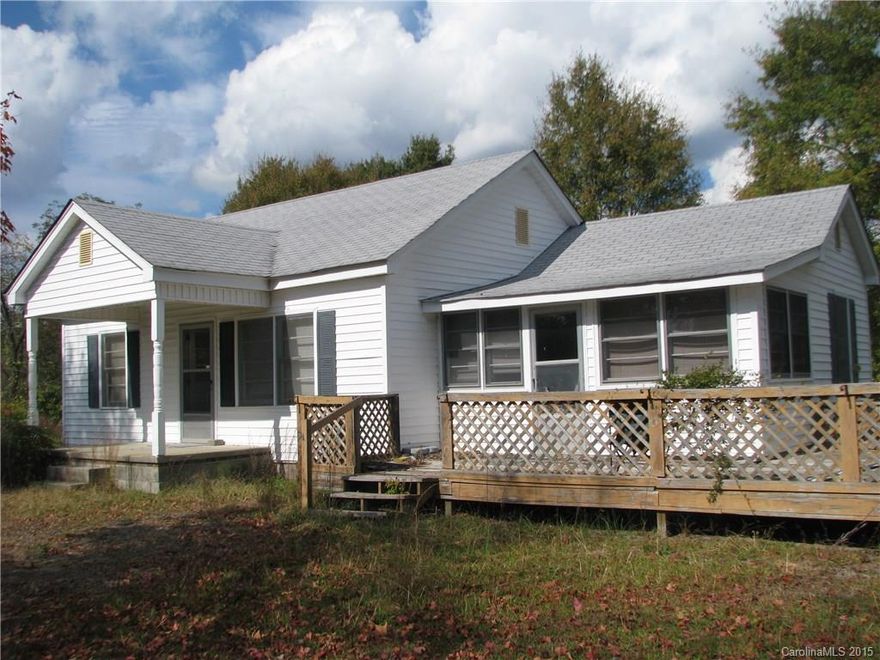 Older Farm House has a very secluded pond in a nicely wooded property.  Land varies from level field overgrown in young pines to slopes going down to stream.  Pond has a covered shelter excellent for outdoor activities.  Wildlife including deer, turkey and small game roam this wooded property.  Young pines could be easily cleared for about 5 acres of pasture, crops or orchards.