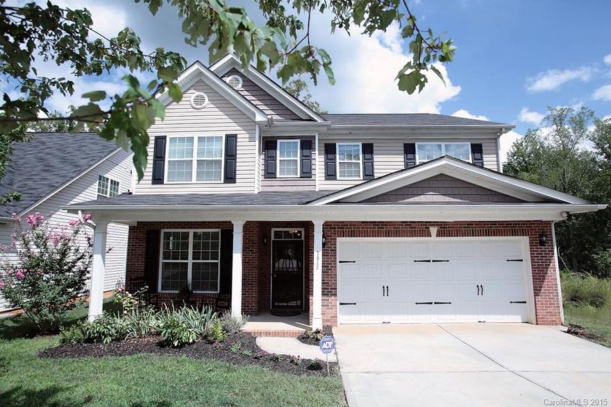 Back on market due to buyer financing falling through! Strolling sidewalks and towering trees are the setting for this home in delightful Hampton Place. The sun-lit open floor plan offers spacious 4 Bedrooms, 2.5 bathrooms, office, bonus room, and broad eat-in kitchen featuring granite countertops and stainless steel appliances.  Also enjoy the warm hardwood floors, cozy fireplace, and fenced in private backyard with deck.  The wooded view is spectacular!