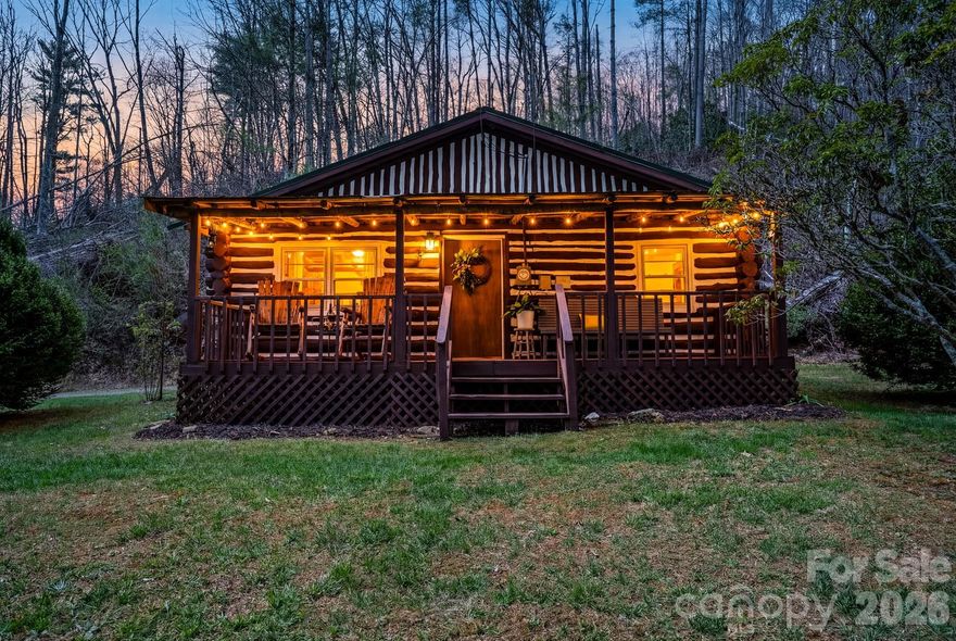 Tucked away in the heart of the mountains, this charming rustic log cabin offers the kind of setting people dream about, where the sound of a gently flowing creek and the stillness of nature greet you the moment you arrive. Situated on 1.7 acres, featuring some gently laying land with creek frontage. This property invites you to slow down, unwind, and truly enjoy mountain living. Thoughtfully updated while preserving its authentic character, the home features a new metal roof (2023), a mini-split system for efficient heating and cooling (2023), and a cozy new wood stove (2023) that creates the perfect atmosphere on cool mountain evenings. The septic system was also pumped in 2023, offering peace of mind for years to come. Inside, you'll find a warm and inviting open-concept layout that seamlessly connects the kitchen, dining, and living areas, ideal for gathering with family or hosting guests. With 2 bedrooms and 1 full bathroom, the home offers a comfortable and functional footprint that feels both intimate and practical. Step outside and enjoy covered front and rear porches, perfect spots for morning coffee, evening conversations, or simply taking in the surrounding natural beauty. The property also includes two outbuildings, a lean-to, and a carport, providing ample storage for tools, outdoor gear, or recreational equipment. Located just minutes from the Blue Ridge Parkway, less than 10 minutes to downtown Spruce Pine, and approximately 15 minutes to Little Switzerland, this property strikes the perfect balance between peaceful seclusion and convenient access to some of the High Country’s most beloved destinations. The nearby North Toe River adds even more opportunity for outdoor adventure, from fishing to tubing and beyond. Whether you're searching for a personal mountain retreat, a short-term rental investment, or a place to create lasting memories, this log cabin captures the essence of what draws people to the mountains in the first place. The Mountains Are Calling...Are You Listening?