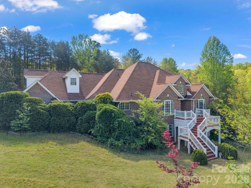 Welcome to this lovingly cared for traditional brick home, perfectly situated on nearly 4 acres just moments from the heart of town. Steeped in classic charm and graced with breathtaking year-round mountain views, this property offers the perfect blend of privacy, convenience, and impressive amenities. A flexible space with a large closet is ideal for a home office, hobby area, or extra guest accommodations.  Whether you love to host gatherings or prefer quiet evenings with friends, the spacious billiard room is the perfect setting for entertainment and relaxation. Once in the kitchen you will notice that the electric cooktop is designed for versatility, featuring interchangeable griddle, grill, and electric burners making it perfect for the home chef!  The large unfinished basement is a blank canvas offering space for storing seasonal items or fitness area or maybe even a playroom.  It could also be an ideal spot for a workshop or crafting area---the choice is yours!  Step out onto the fenced back patio, where a large gazebo creates an inviting space for outdoor dining, entertaining, or simply relaxing in privacy. The expansive grounds offer ample room for gardening, play, or future enhancements.  This home allows for owners to be able to enjoy the tranquility of country living with the convenience of being very close to shopping, dining, the hospital and the interstate. Whether you desire privacy or would like to host gatherings, or simply seek inspiration from the scenic views, this home is a rare opportunity to have it all.  Don’t miss your chance to own this exceptional property—schedule your private tour today!