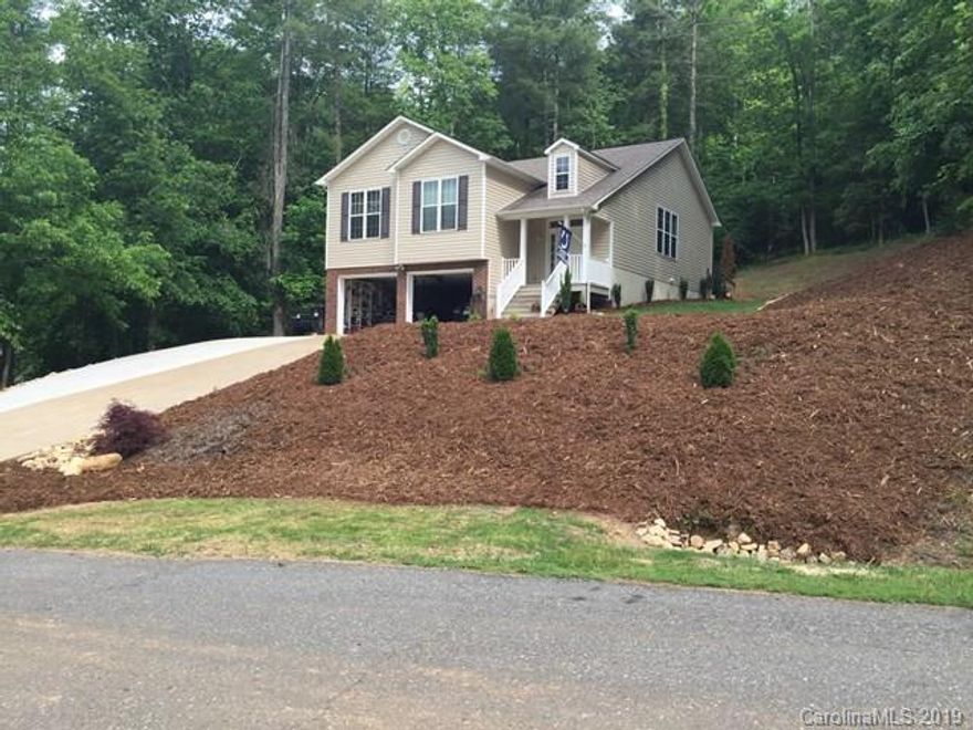 Beautiful home located in Glen Alpine. This home has many extras and is in excellent condition. Open floor plan with bedrooms, laundry area  and living room with natural gas logs on the main level. An additional 3rd bath, game room and bar in the basement with a ductless heat and air system. The double garage has custom built shelving for storage. Large composite deck with a hot tub, beautifully landscaped yard and lots of curb appeal. Walking trails to the Catawba River in the cul-de-sac to the left of the property. Must See