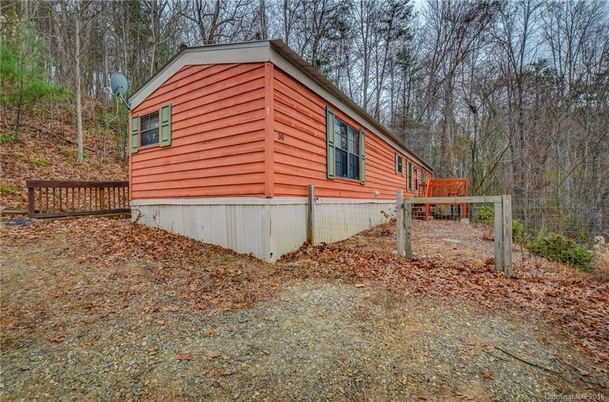 Move In Condition. Investors & College Student parents take notice! Great 3/2 trailer 5 minutes to Asheville Mall & views! Metal roof, wood siding, newer appliances, carpet, laminate flooring, & City water, Propane back up, make this affordable home the perfect place to call home or an income producer. Fenced lot ready for pets. Steep drive. Perfect reason for a 4 wheeler for those few days of snow. Maybe build drive from road above? Extra parking area can be made too. Watch HD Video!