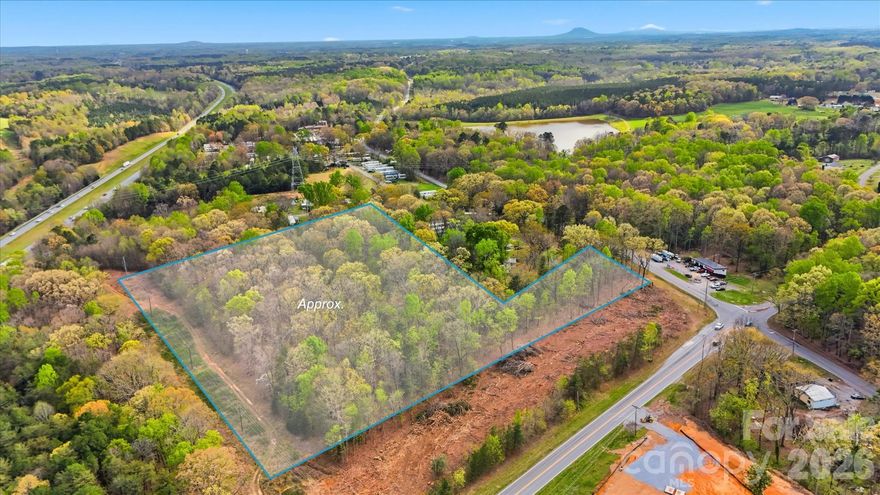 Over 13 acres minutes from HWY 321 in Dallas. Roughly 343 feet of visibility from 321 and 146 feet of road frontage on Dallas High Shoals HWY.  Zoned C-2. Duke Power Easement runs through property.