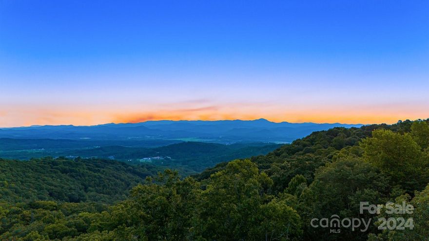 Imagine living on a 2.68-acre homesite nestled in the serene community of Couch Mountain, surrounded by breathtaking natural beauty. Lot 51 boasts unparalleled long-range mountain views to the southwest/west, offering a glimpse of the majestic Mount Pisgah. This stunning homesite features a gentle to relatively flat topography, ensuring ease of development and ample privacy. Additionally, its lower boundaries adjoin the magnificent 138+ acre Nature Preserve, home to the Maple Hollow Trail. Couch Mountain offers an idyllic lifestyle. Residents can access two community gardens, a greenhouse, an apiary, and the impressive 138+-acre Nature Preserve. The preserve is a nature lover's paradise, featuring over 4 miles of hiking and biking trails. Situated between Hendersonville and Asheville, this location allows convenient access to mountain towns' charm and beauty.